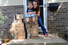 Heather Robertson, with her 2-year-old son,  receives stacks of Amazon boxes full of medical supplies daily. (Courtesy of  Heather Robertson)